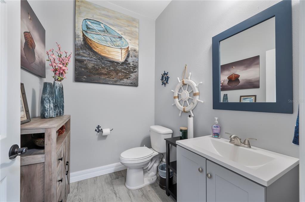 2525 Ranchland Acres Road Lakeland, FL 33809 - Photo 29 of 68 a bathroom with a toilet sink and mirror