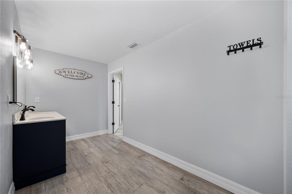 2525 Ranchland Acres Road Lakeland, FL 33809 - Photo 51 of 68 a bathroom with a sink and mirror