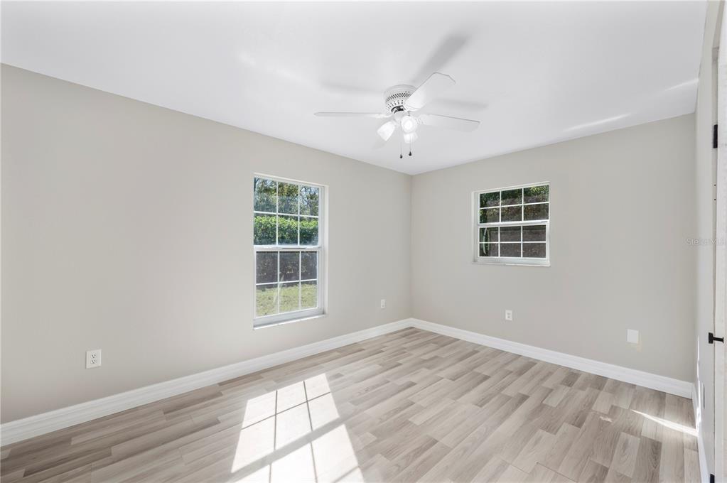 2525 Ranchland Acres Road Lakeland, FL 33809 - Photo 58 of 68 a view of an empty room with wooden floor and a window