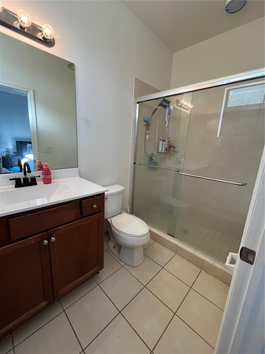 Hialeah Hialeah, FL 33018 - Photo 11 of 23 a bathroom with a sink a toilet and shower