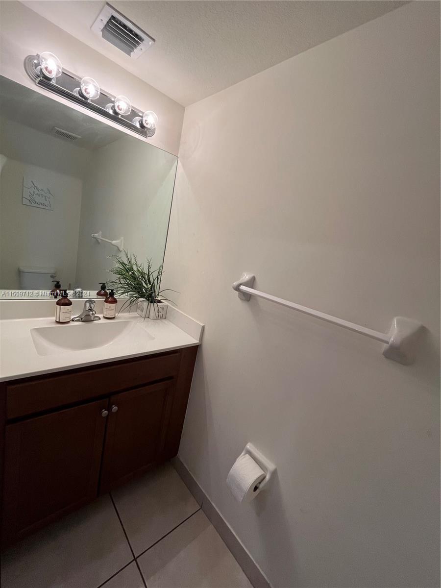 Hialeah Hialeah, FL 33018 - Photo 12 of 23 a bathroom with a sink and mirror
