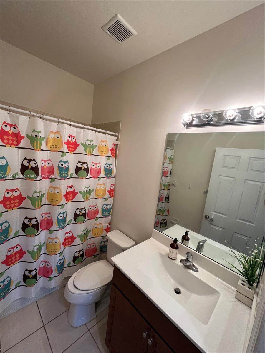 Hialeah Hialeah, FL 33018 - Photo 15 of 23 a bathroom with a sink mirror and toilet