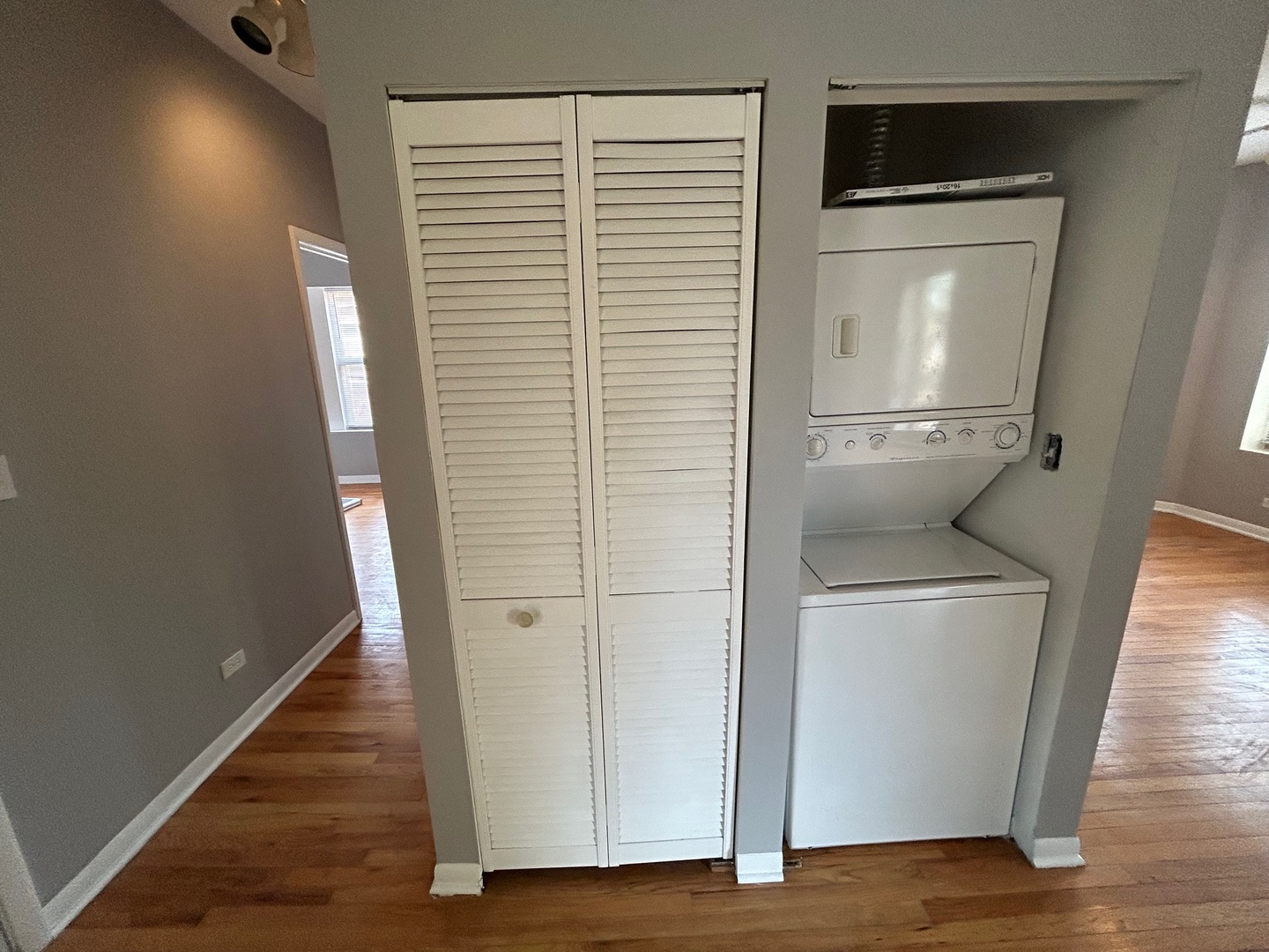 8158 South Drexel Avenue, Unit 3 Chicago, IL 60619 - Photo 9 of 12 a view of washer and dryer with wooden floor