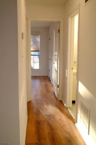 a view of a porch with a floor to ceiling window