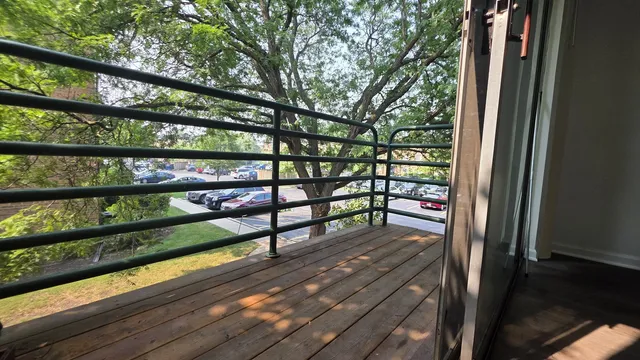 a balcony with wooden floor