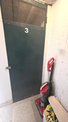 a bathroom with a toilet and a shower curtain