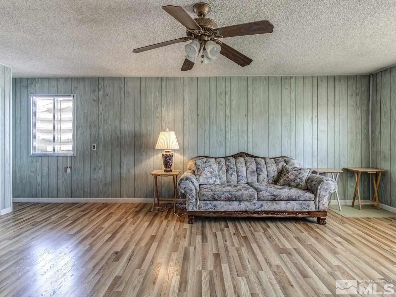 1120 Manhattan Street Reno, NV 89512 - Photo 12 of 23 a living room with furniture and a wooden floor