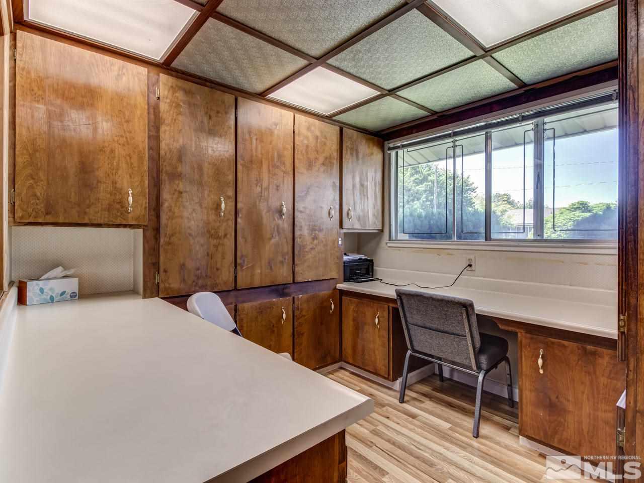 1120 Manhattan Street Reno, NV 89512 - Photo 17 of 23 a bedroom with a bed a table and chair