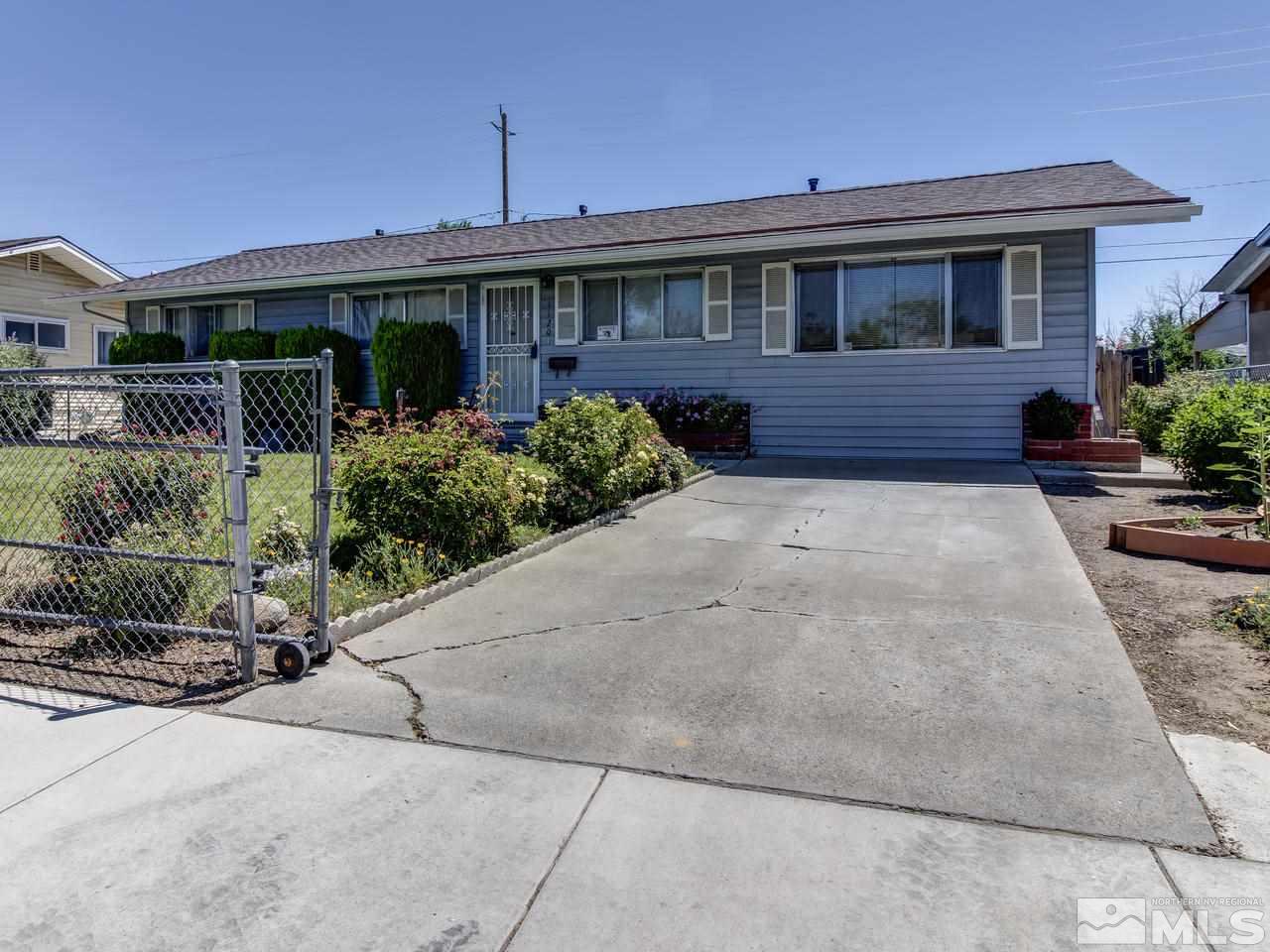 1120 Manhattan Street Reno, NV 89512 - Photo 3 of 23 a front view of a house with garden