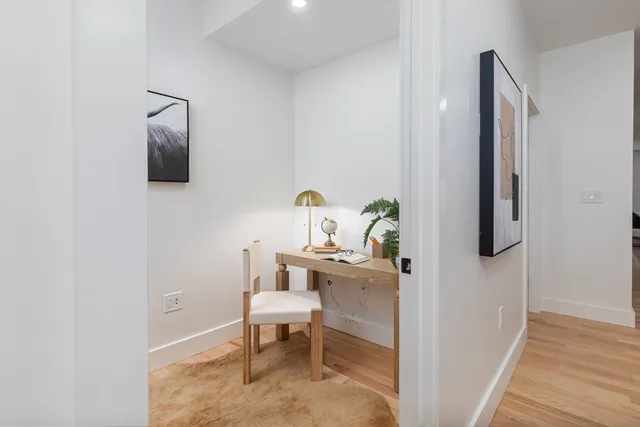 a bathroom with a window and a shower