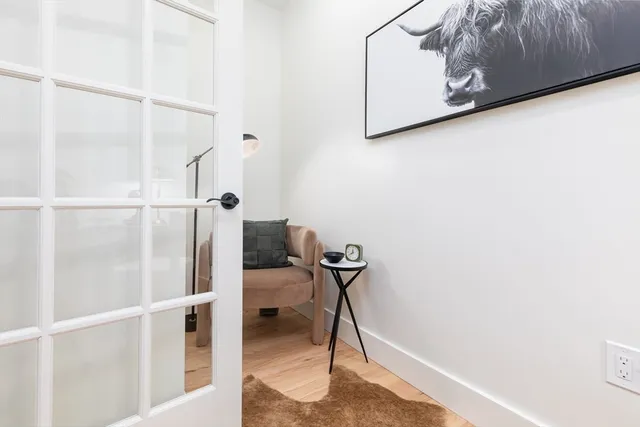 a bathroom with a sink toilet and a mirror