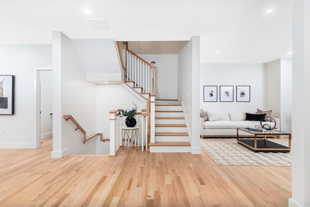 34 Waverly Place, Unit 34 Melrose, MA 02176 - Photo 18 of 39 a view of a room with stairs and a wooden floor