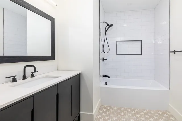 a en suite bathroom with a sink and a mirror