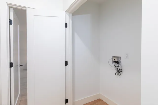 a bedroom with a bed and a mirror