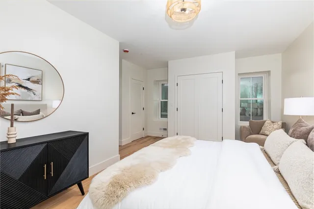 a living room with furniture and a lamp