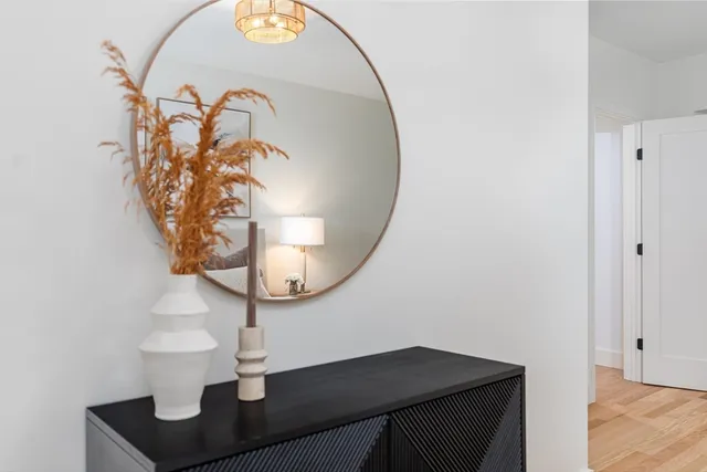 a bathroom with a sink a toilet and mirror