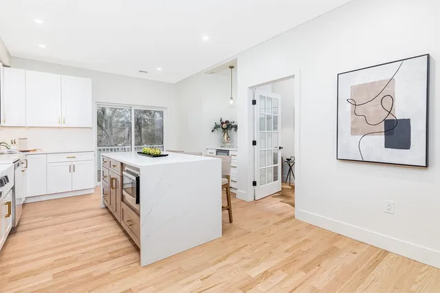 a kitchen with a stove a sink and a refrigerator
