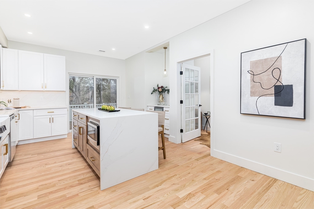 34 Waverly Place, Unit 34 Melrose, MA 02176 - Photo 5 of 39 a kitchen with a stove a sink and a refrigerator