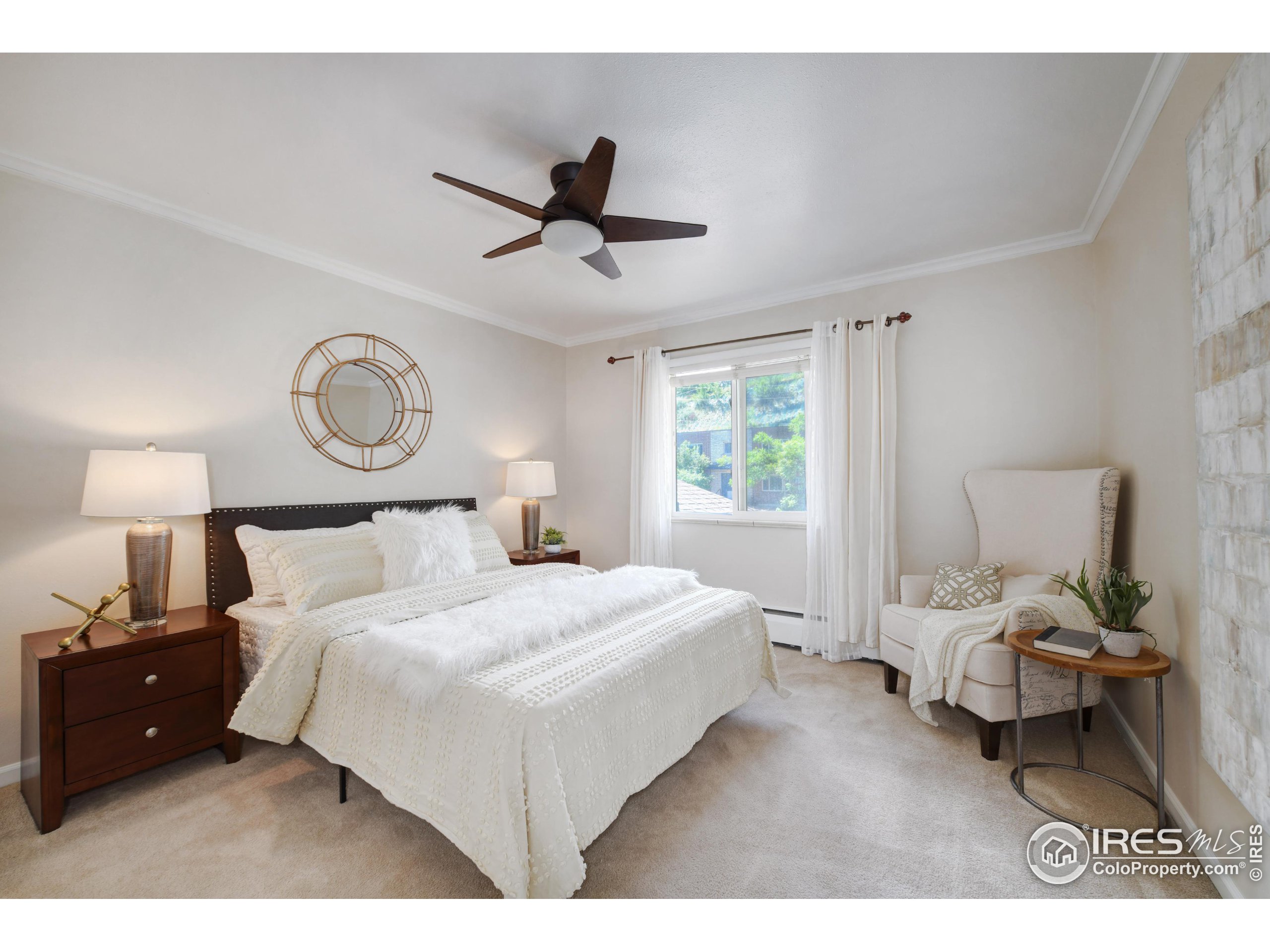 1895 Alpine Avenue, Unit E18 Boulder, CO 80304 - Photo 14 of 26 a bedroom with a bed and window