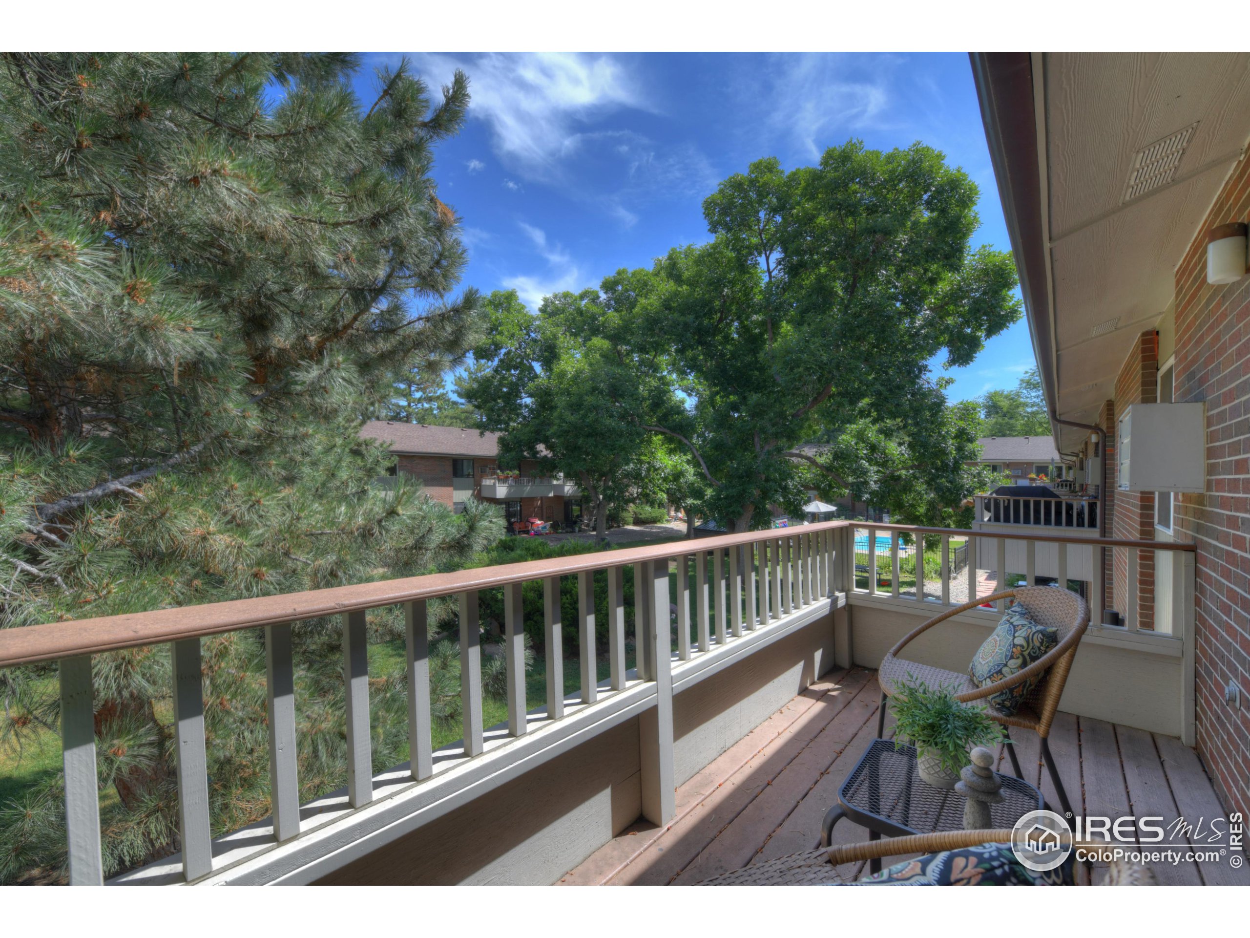 1895 Alpine Avenue, Unit E18 Boulder, CO 80304 - Photo 21 of 26 a view of balcony with furniture