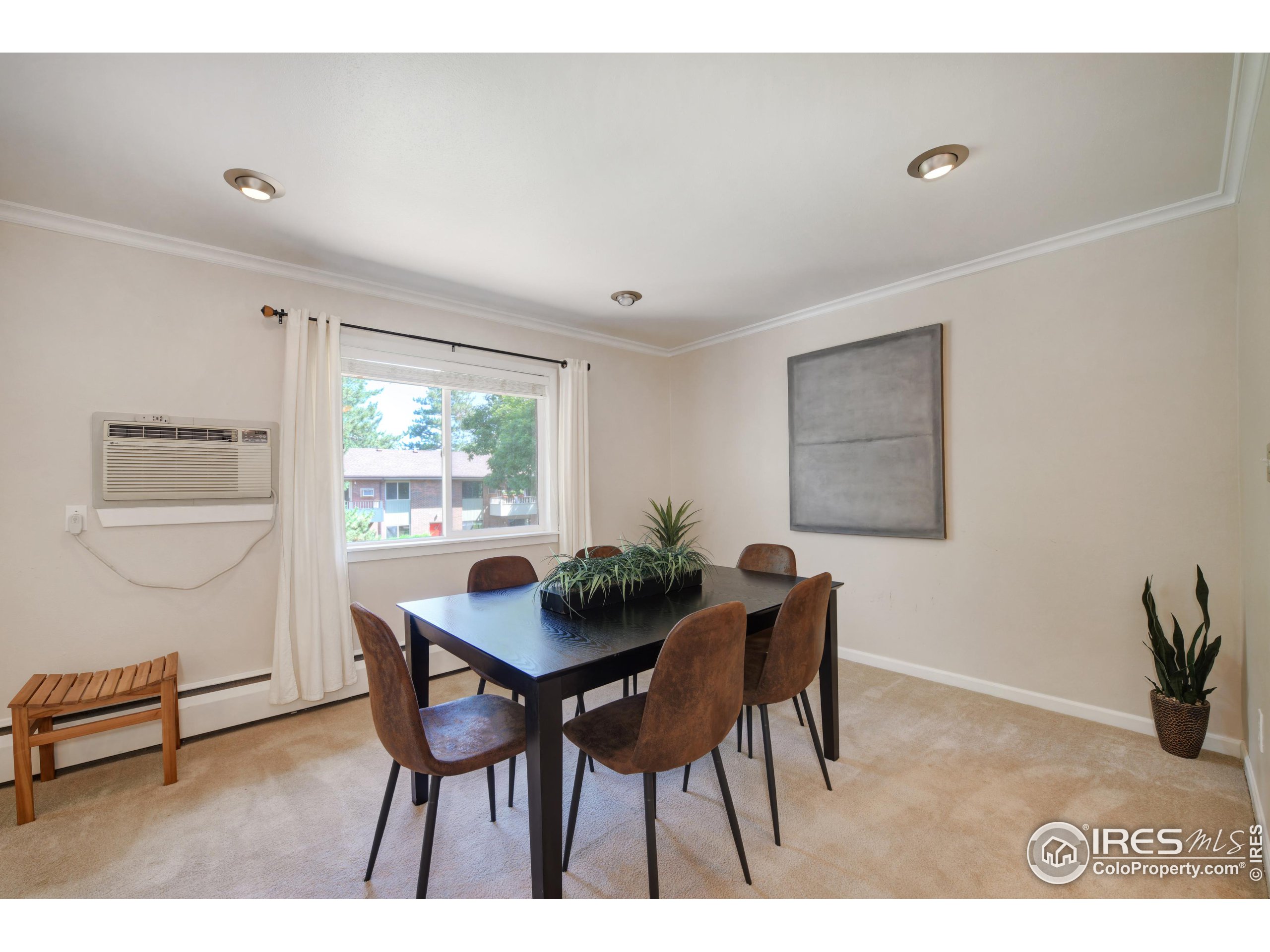 1895 Alpine Avenue, Unit E18 Boulder, CO 80304 - Photo 8 of 26 a dining room with furniture and window