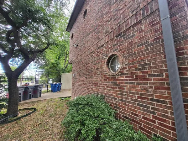a brick building with a yard
