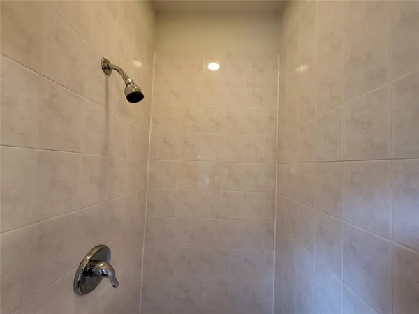 a white toilet sitting in a bathroom