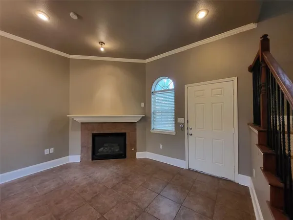 a view of an empty room with a fireplace