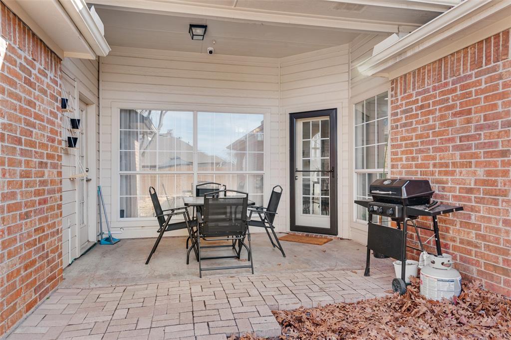 106 Villanova Circle Forney, TX 75126 - Photo 23 of 26 a patio with table and chairs