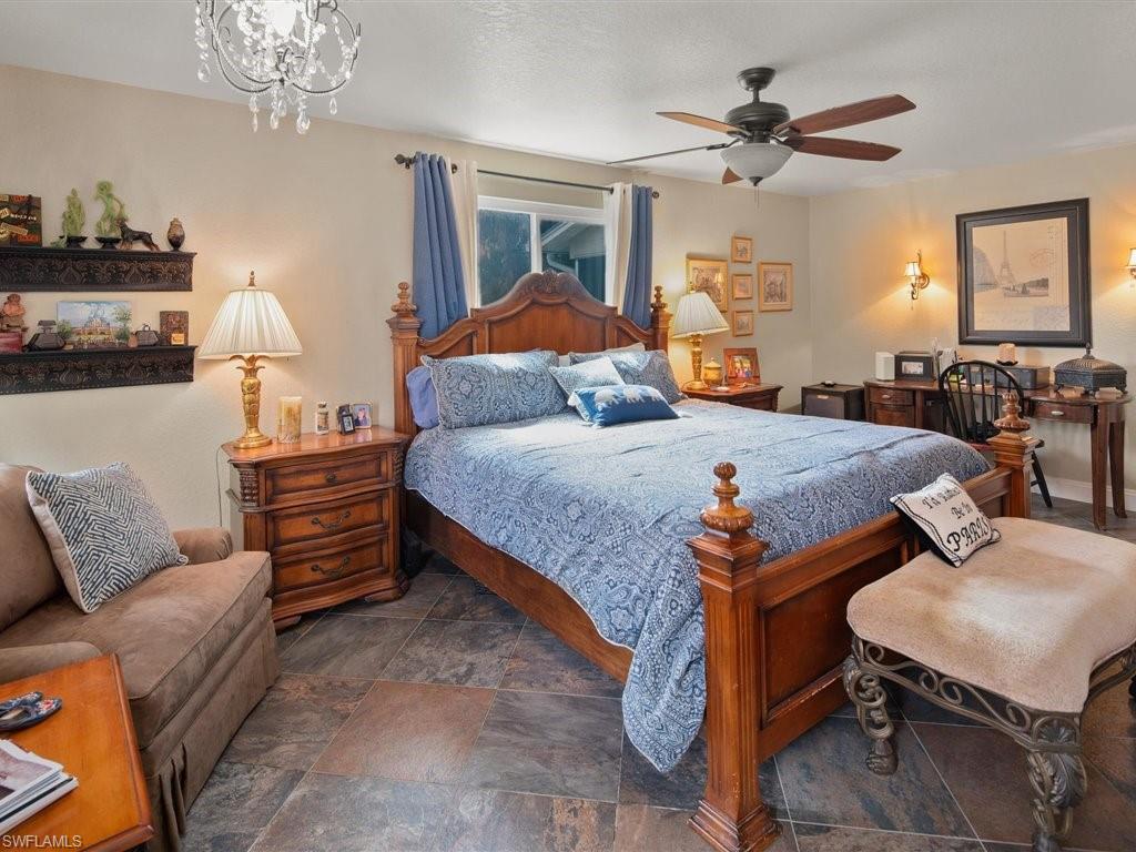 920 10th Street Southeast Naples, FL 34117 - Photo 11 of 16 a bedroom with bed and wooden floor