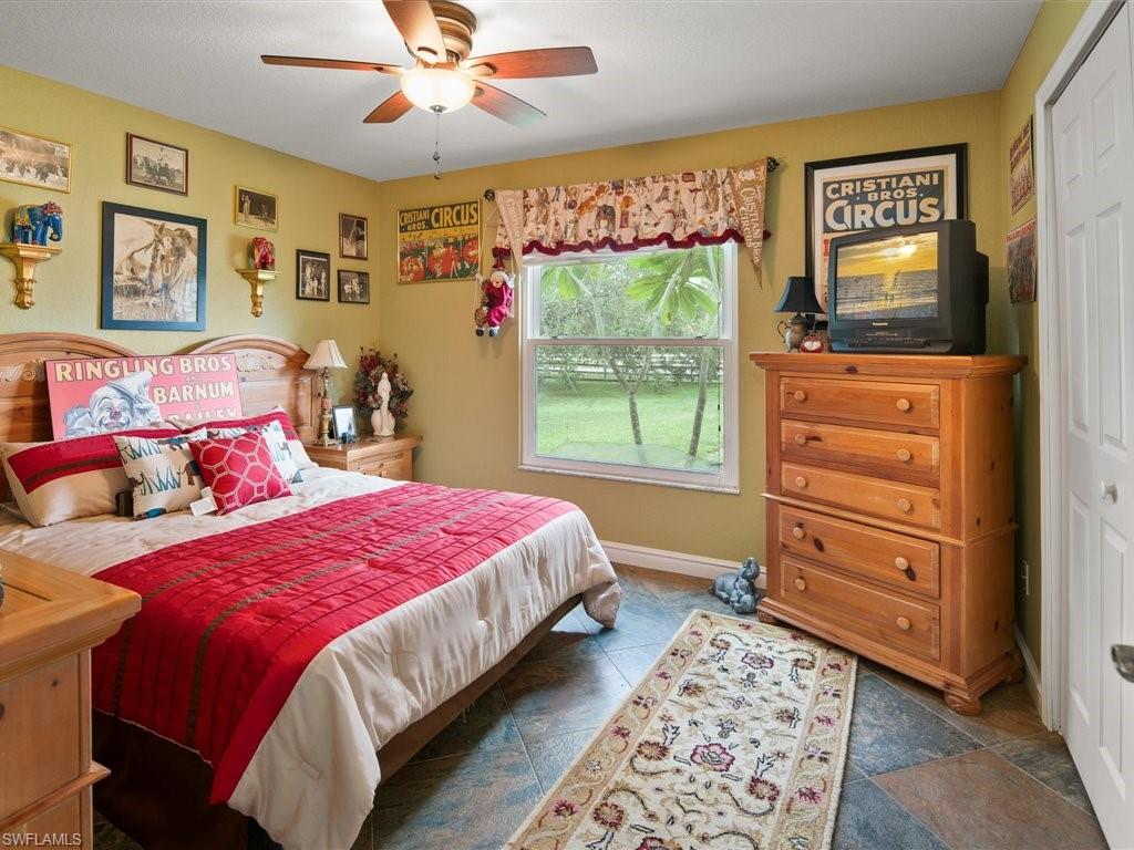 920 10th Street Southeast Naples, FL 34117 - Photo 16 of 16 a bedroom with a bed and a window