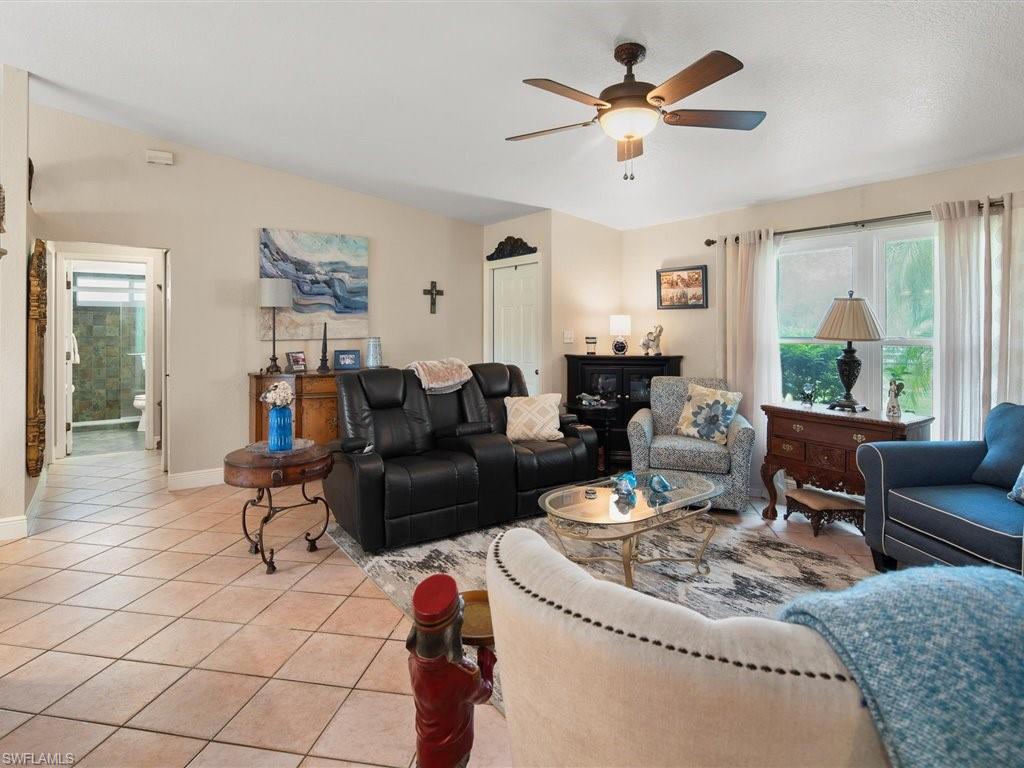 920 10th Street Southeast Naples, FL 34117 - Photo 6 of 16 a living room with furniture and a large window