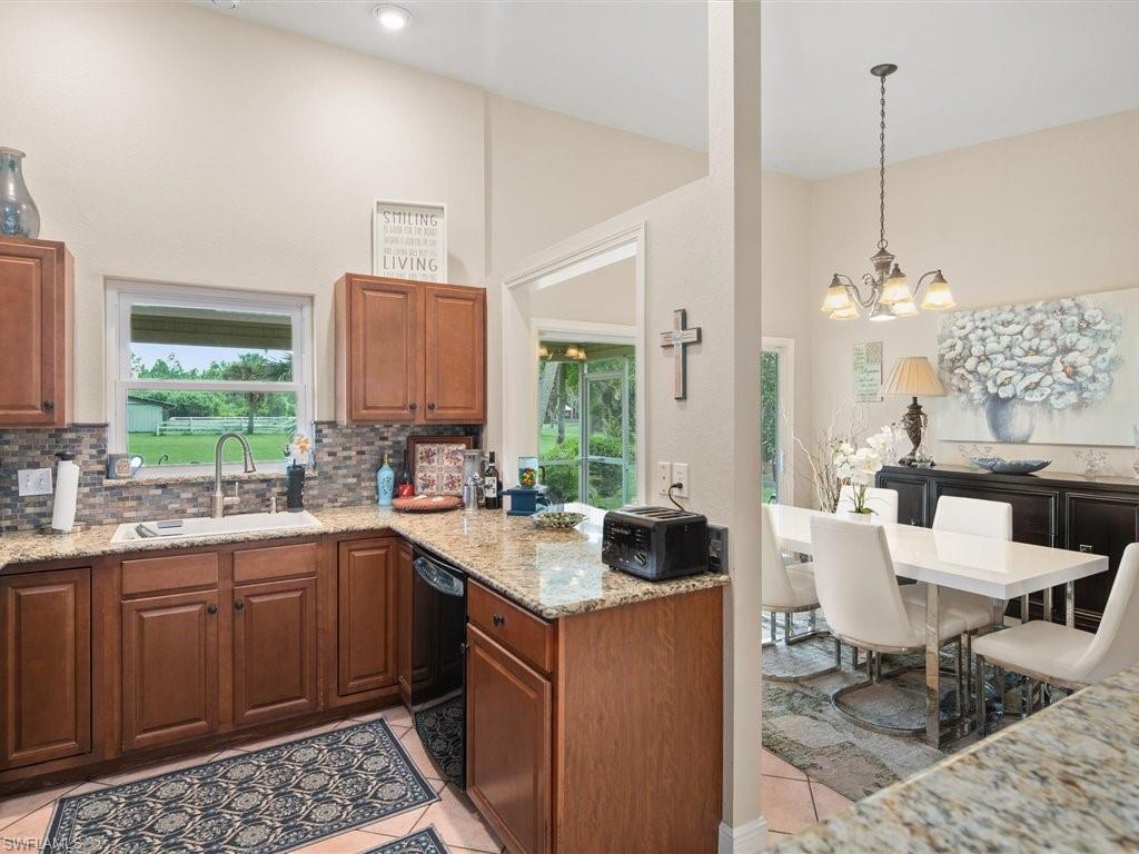 920 10th Street Southeast Naples, FL 34117 - Photo 10 of 16 a kitchen with a sink and cabinets