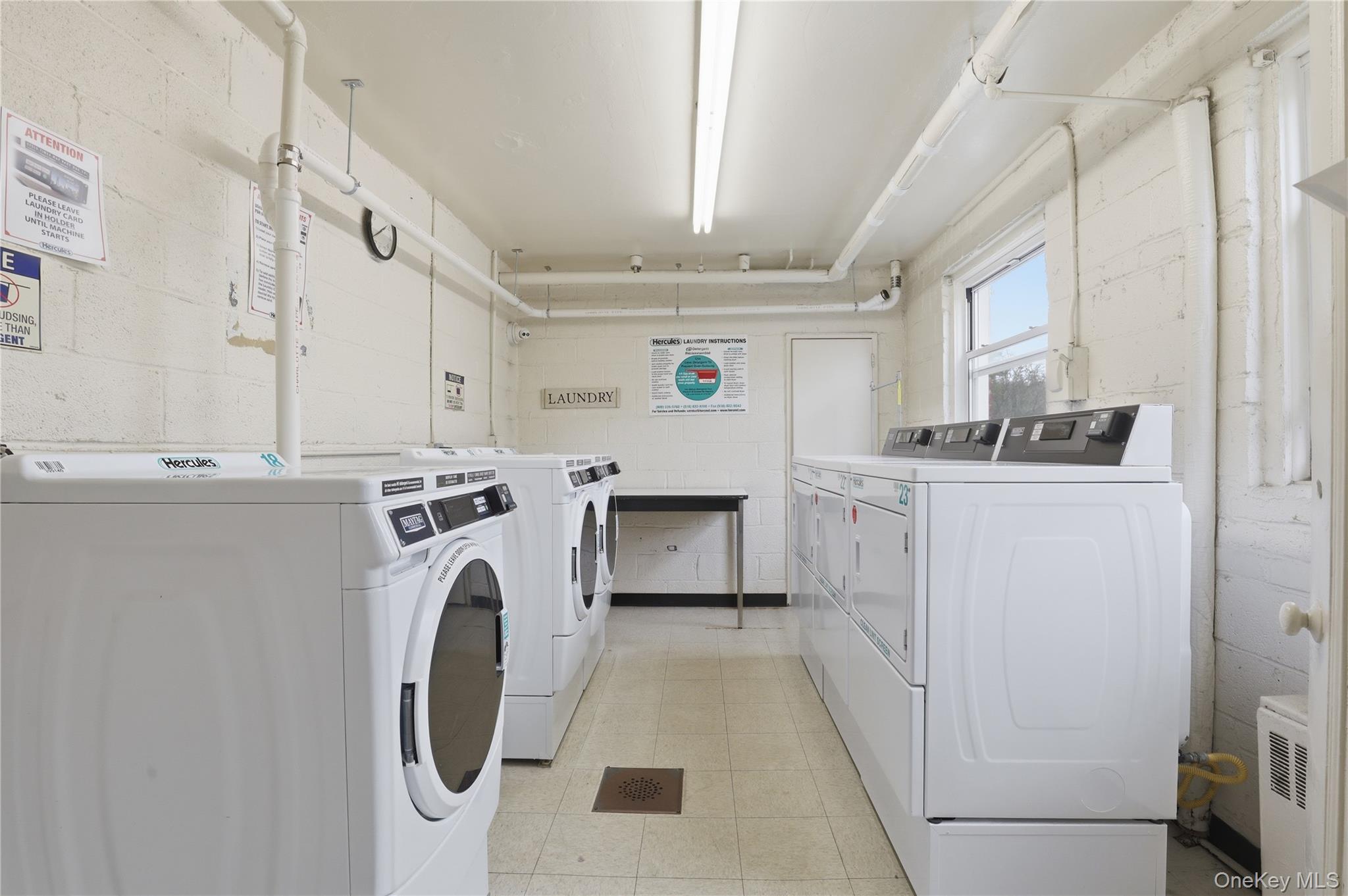 352 North State Road, Unit 1H Briarcliff Manor, NY 10510 - Photo 18 of 20 a utility room with dryer and washer