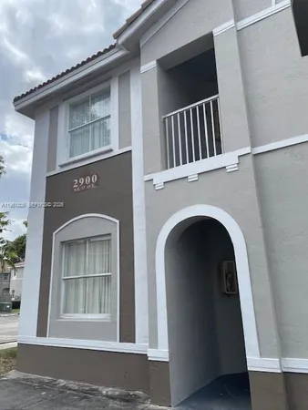 a view of a house with a door and a door