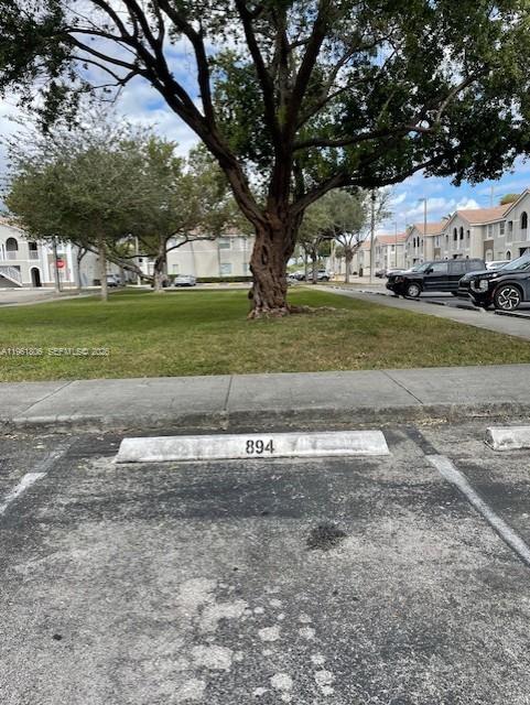2900 Southeast 17th Avenue, Unit 103 Homestead, FL 33035 - Photo 14 of 16 a view of a house with a big yard