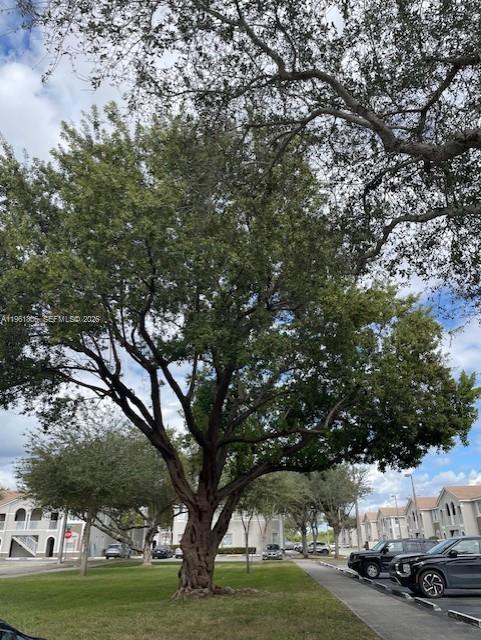 2900 Southeast 17th Avenue, Unit 103 Homestead, FL 33035 - Photo 15 of 16 a view of street with parked cars