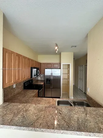 a view of a livingroom with furniture and an entryway