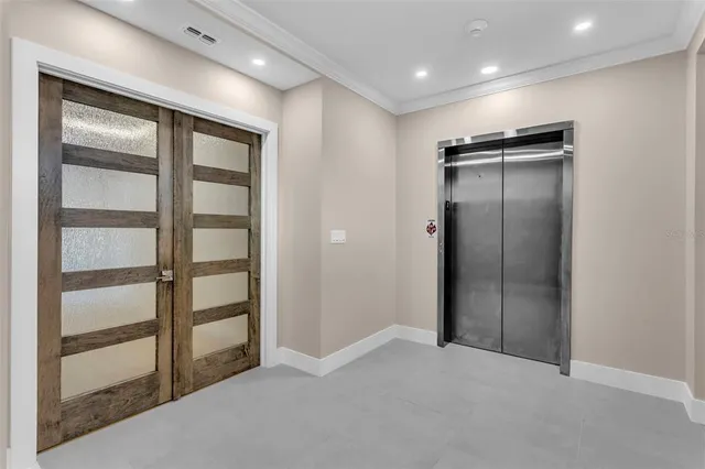 a view of an empty room with a closet