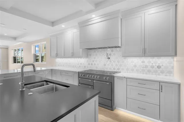 a bedroom with a bed and large window