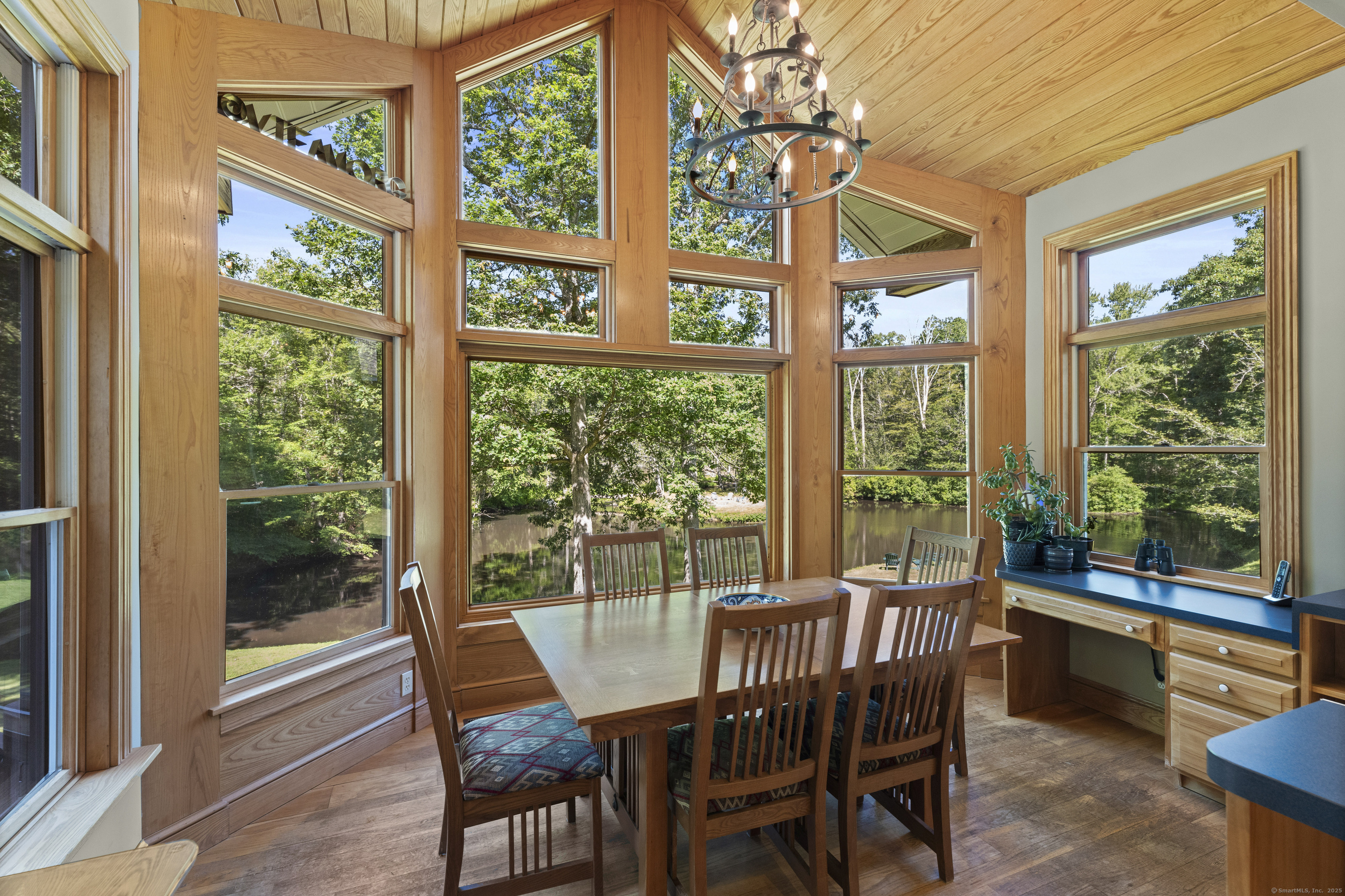 70 Morgan Road Salem, CT 06420 - Photo 12 of 38 a view of a dining room with furniture large windows and wooden floor