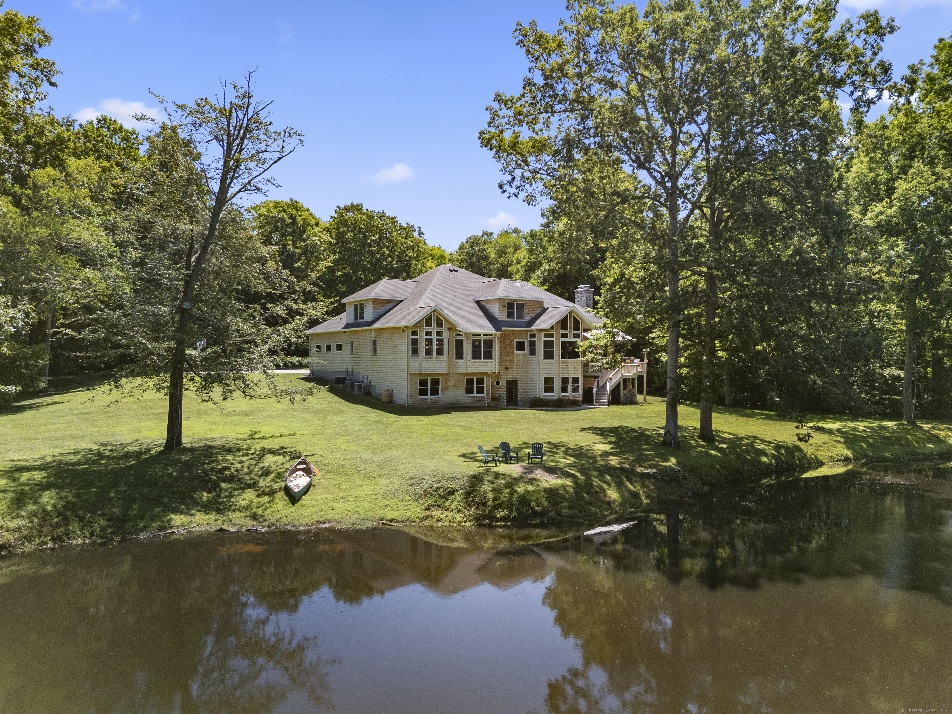 70 Morgan Road Salem, CT 06420 - Photo 2 of 38 a house with river in front of it