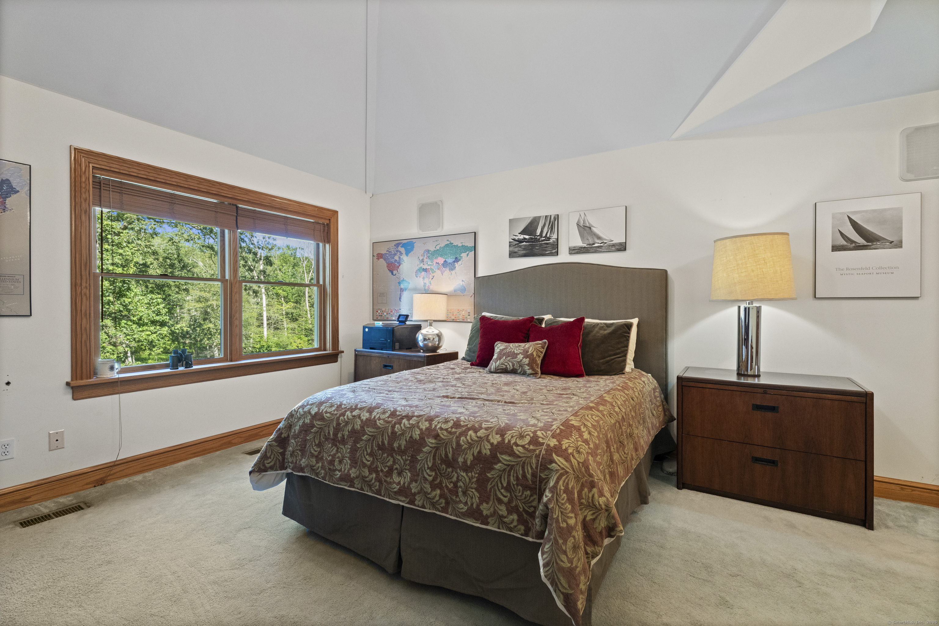 70 Morgan Road Salem, CT 06420 - Photo 22 of 38 a bedroom with a bed lamp and window