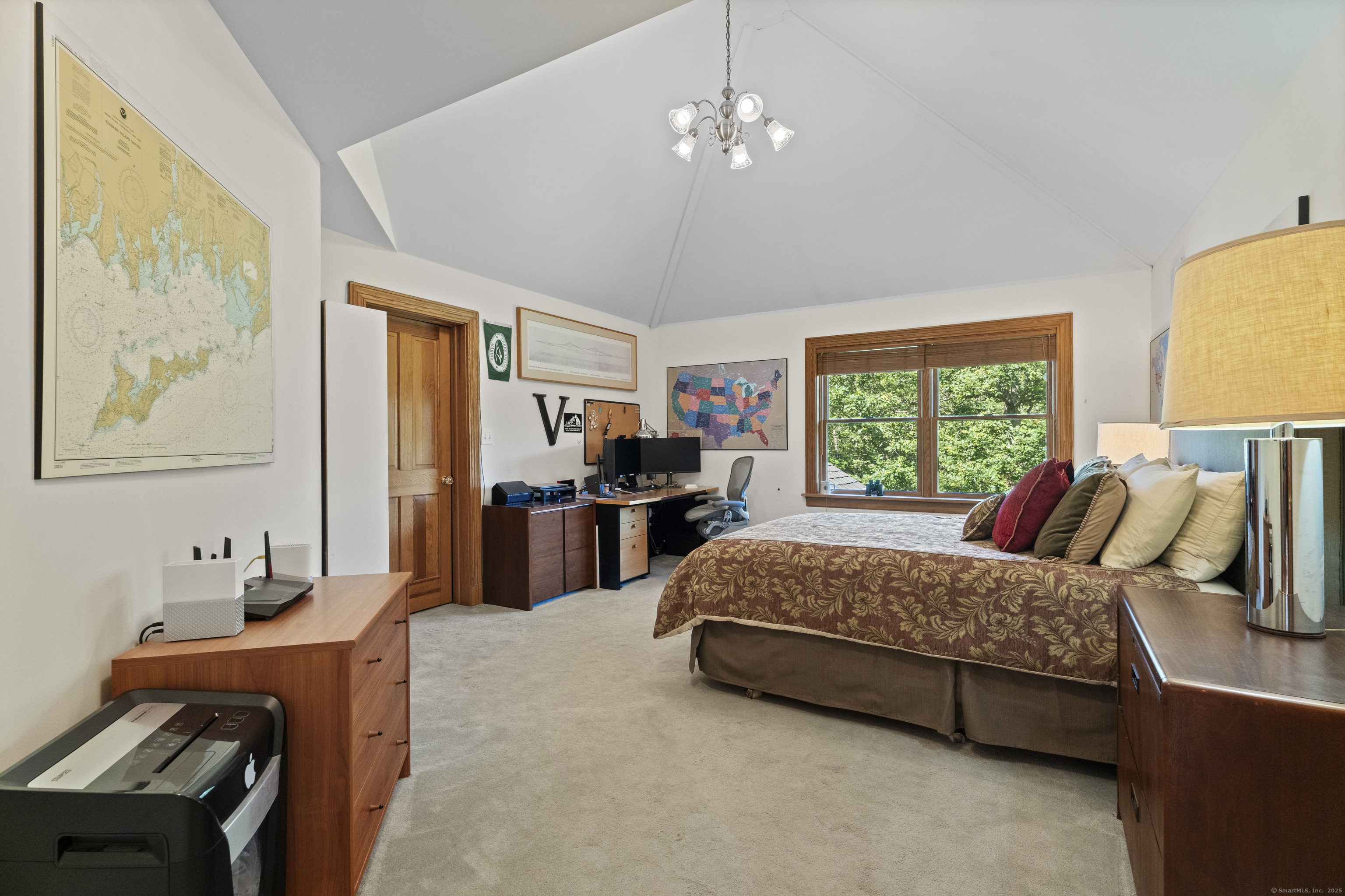 70 Morgan Road Salem, CT 06420 - Photo 23 of 38 a bedroom with a bed and a chandelier