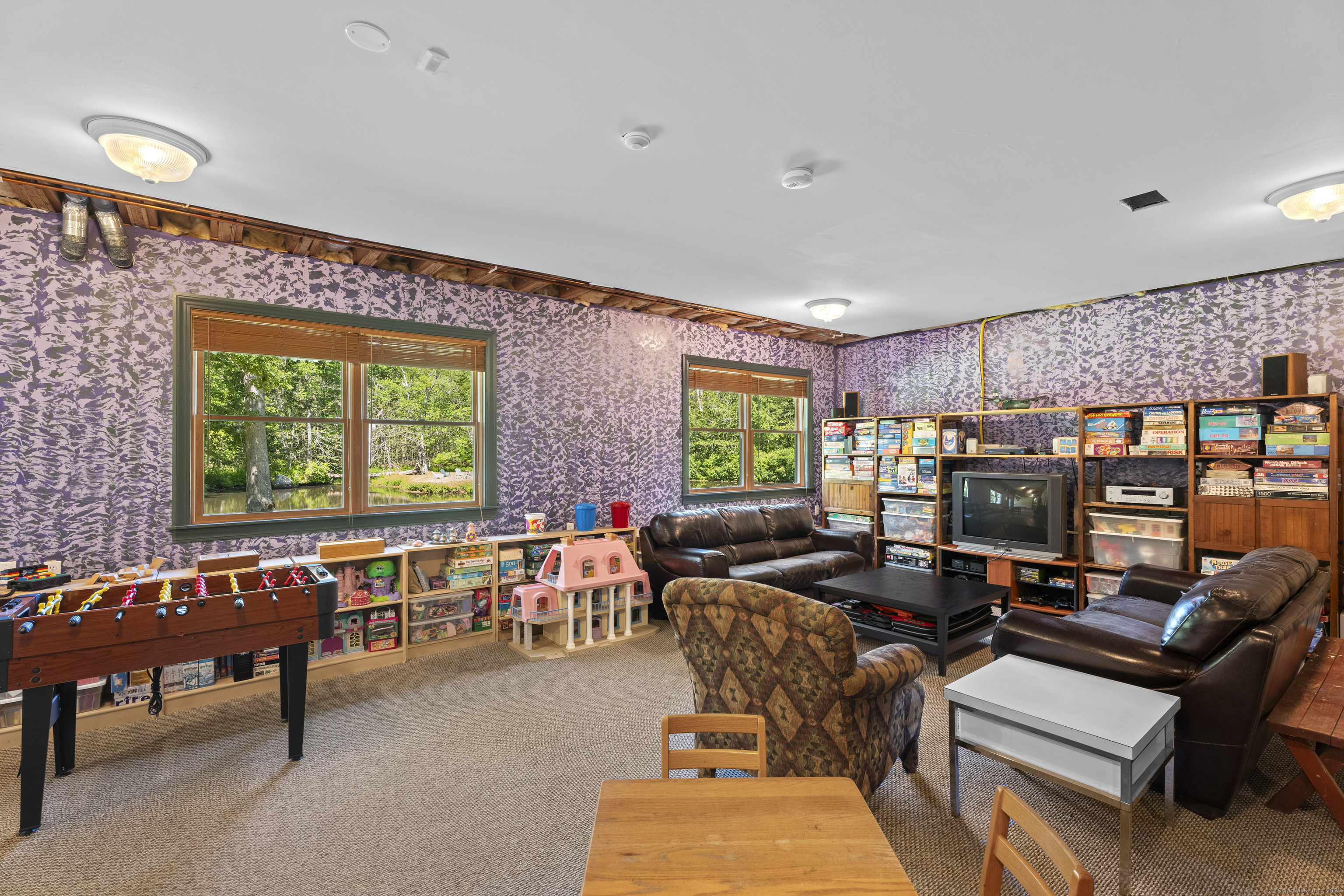 70 Morgan Road Salem, CT 06420 - Photo 27 of 38 a living room with furniture and a floor to ceiling window