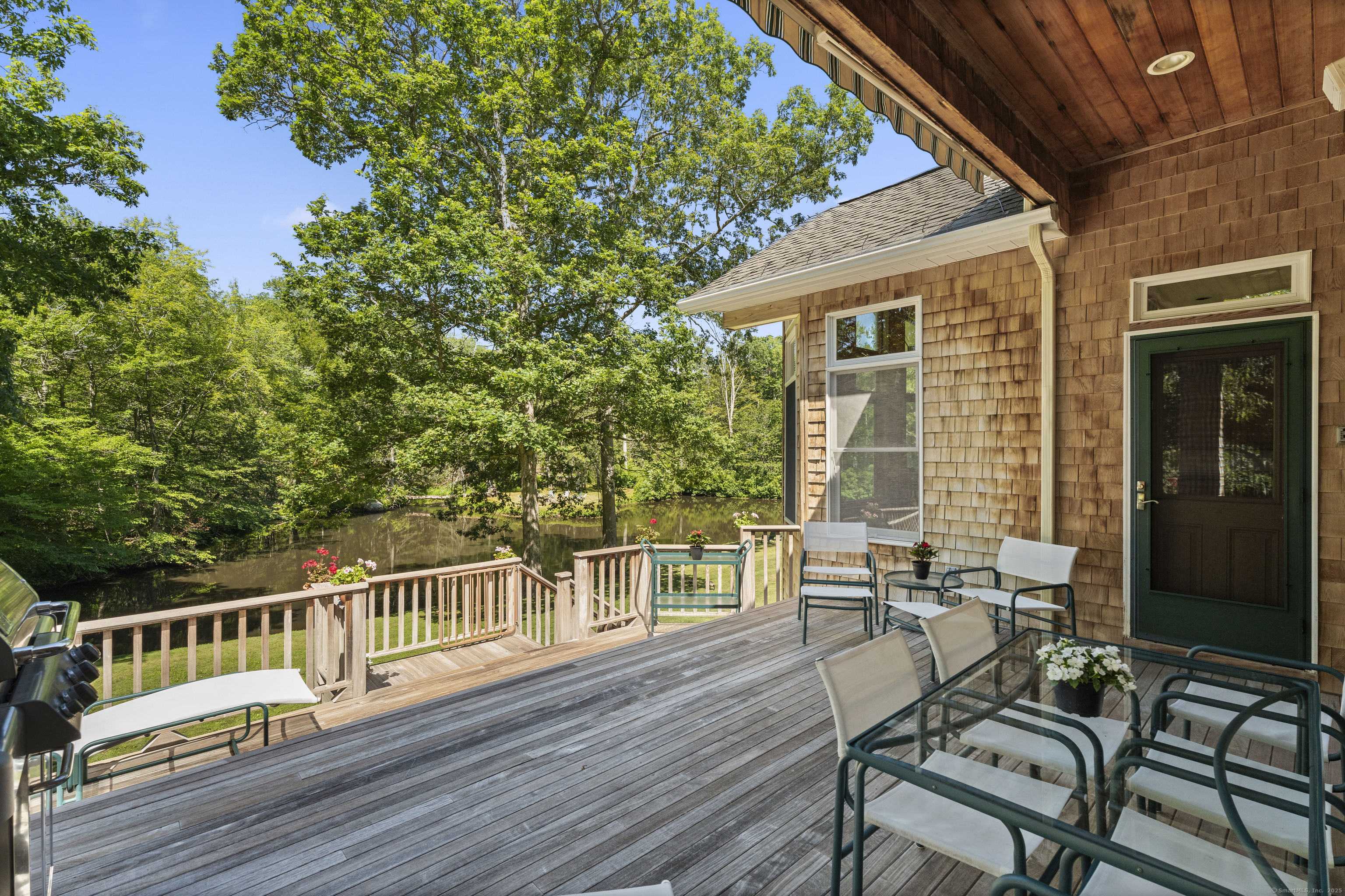 70 Morgan Road Salem, CT 06420 - Photo 28 of 38 a view of a chairs and table on the wooden deck