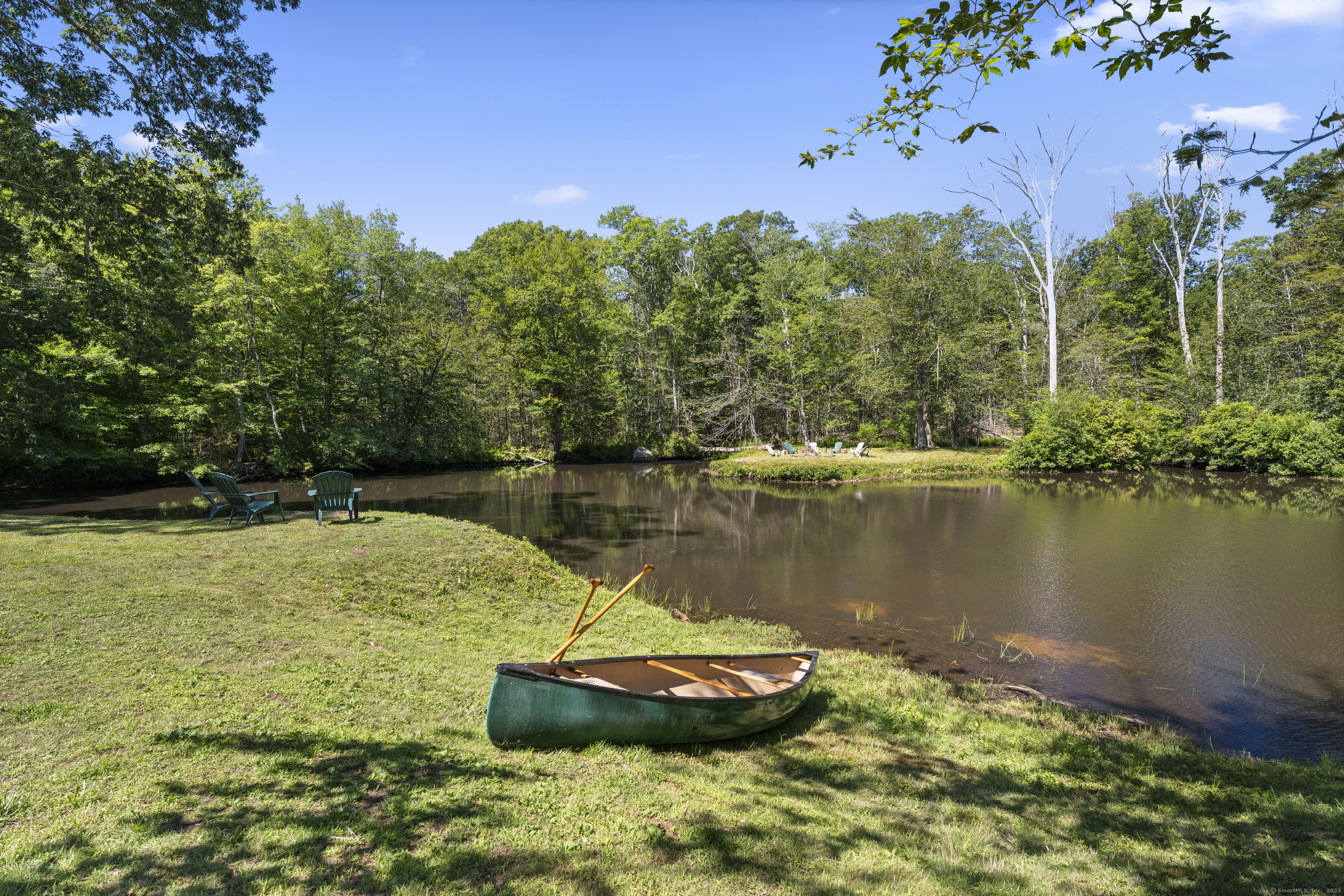 70 Morgan Road Salem, CT 06420 - Photo 31 of 38 a view of a lake with a yard
