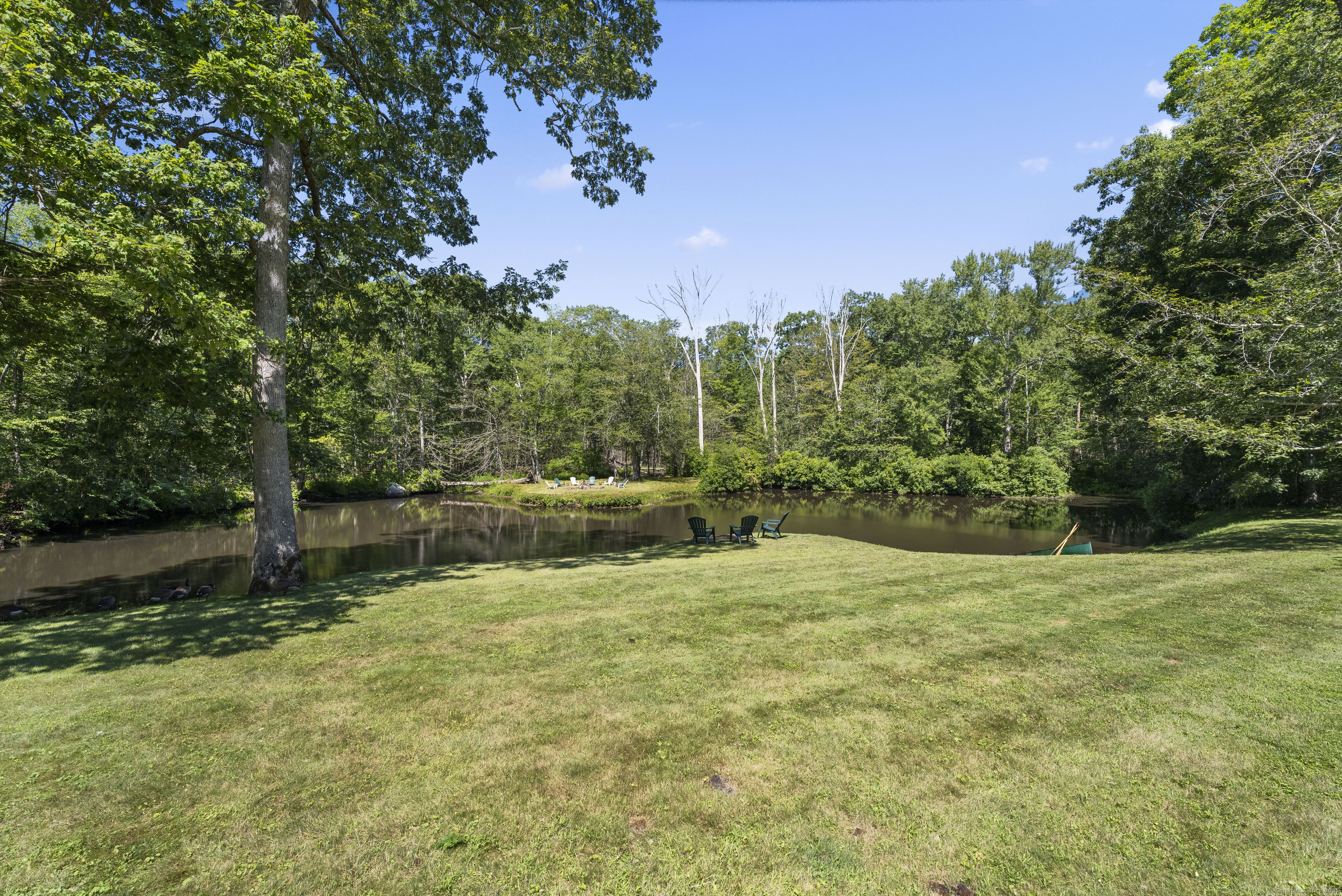 70 Morgan Road Salem, CT 06420 - Photo 33 of 38 a backyard of a house with lots of green space