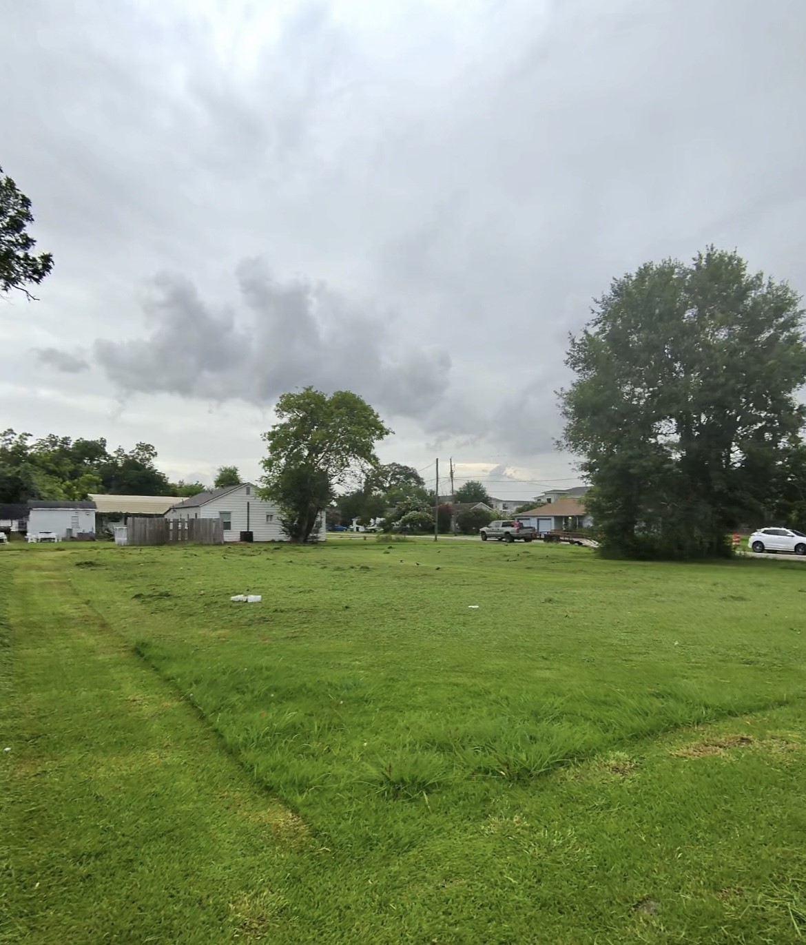9 Northridge Drive Baytown, TX 77521 - Photo 2 of 5 a view of a field of grass and trees