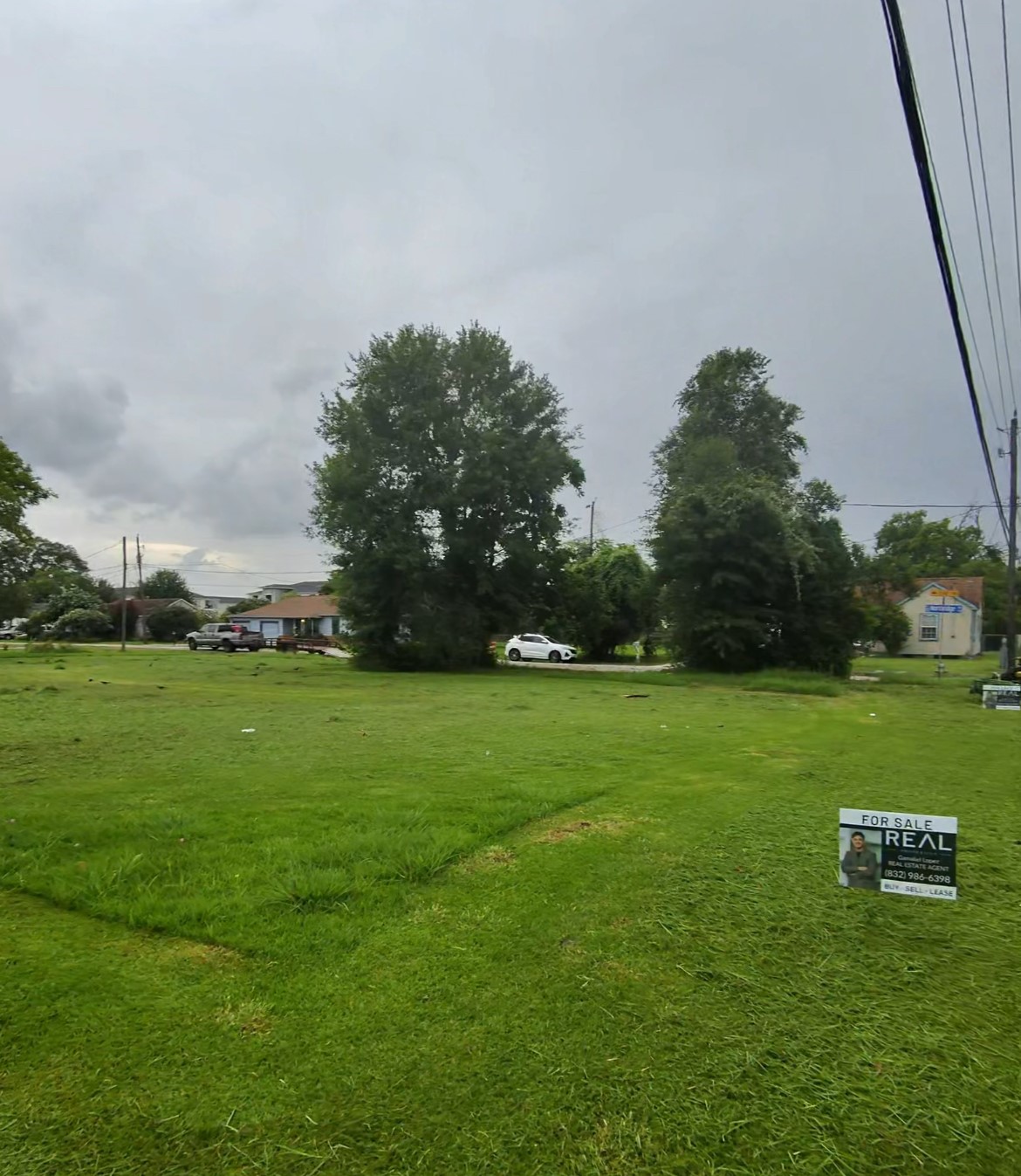 9 Northridge Drive Baytown, TX 77521 - Photo 4 of 5 a view of a field of grass and trees
